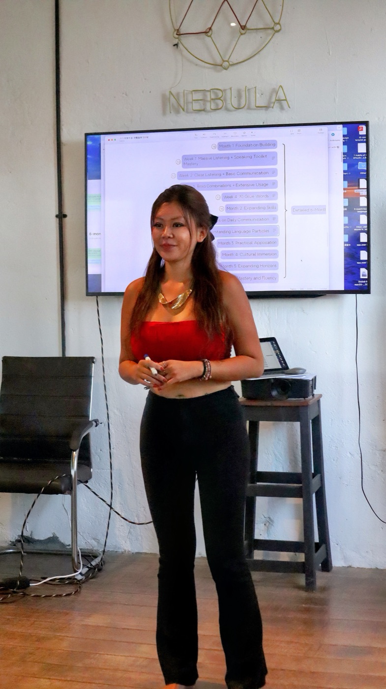 Stella presenting in front of a screen in Bali